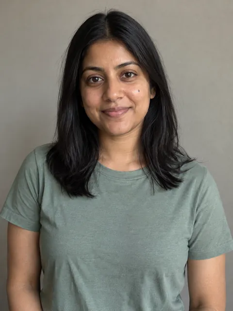 AI-created reference portrait of a woman in a sage T-shirt, facing the camera